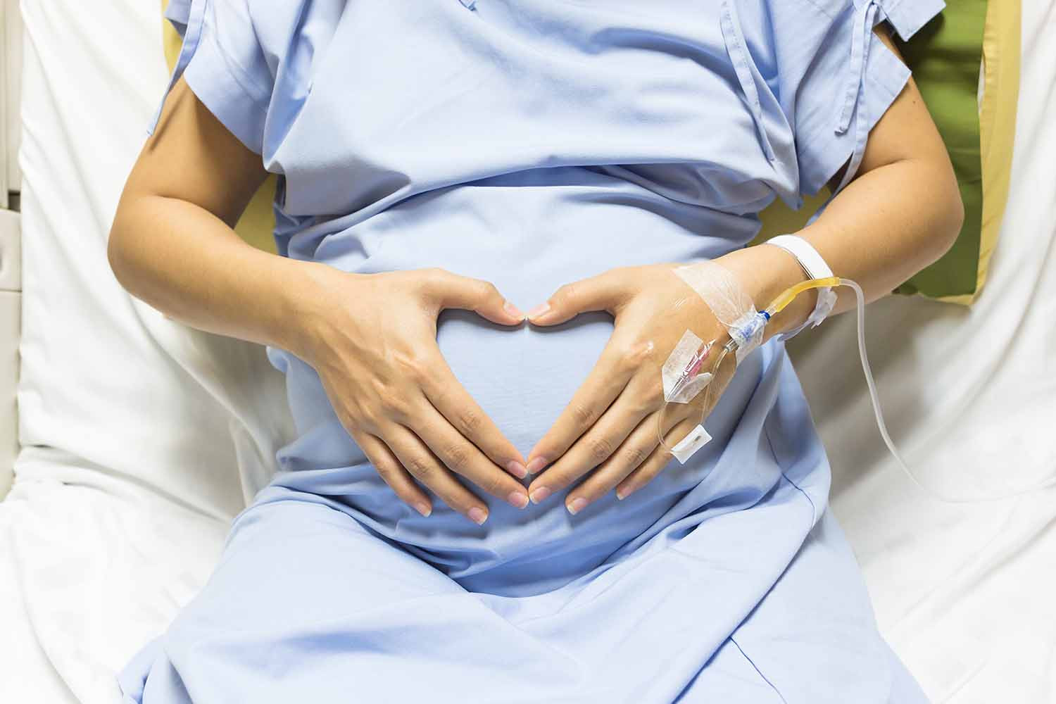 Pregnant Woman patient is hands shaped heart-shutterstock_455693302.jpg